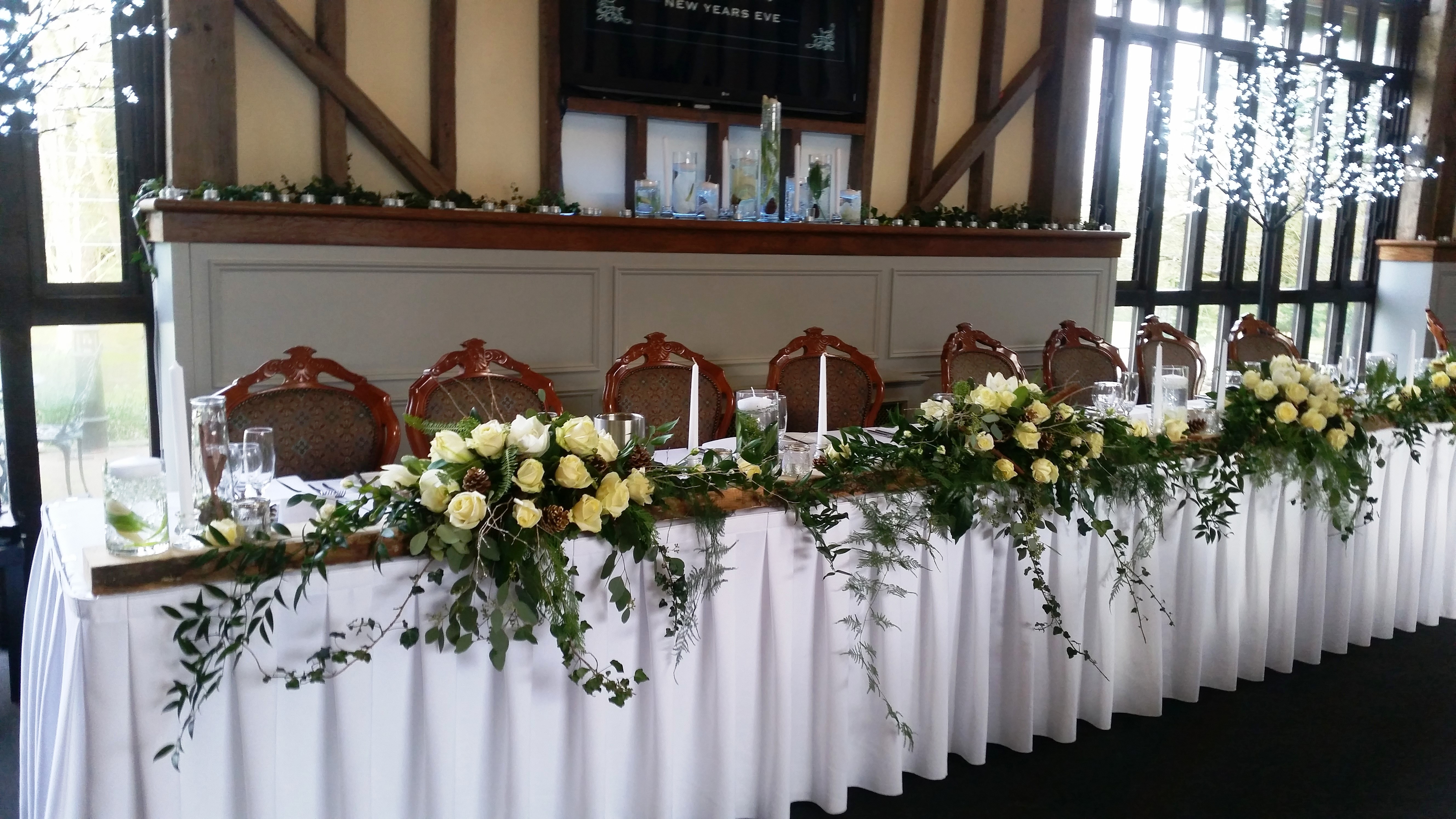 Wedding top table yellow roses