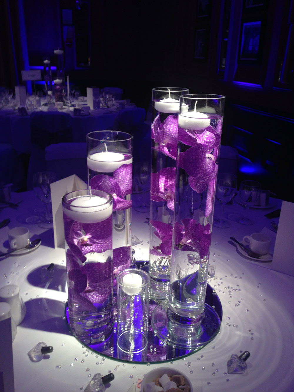 Modern purple glass vases orchids candles